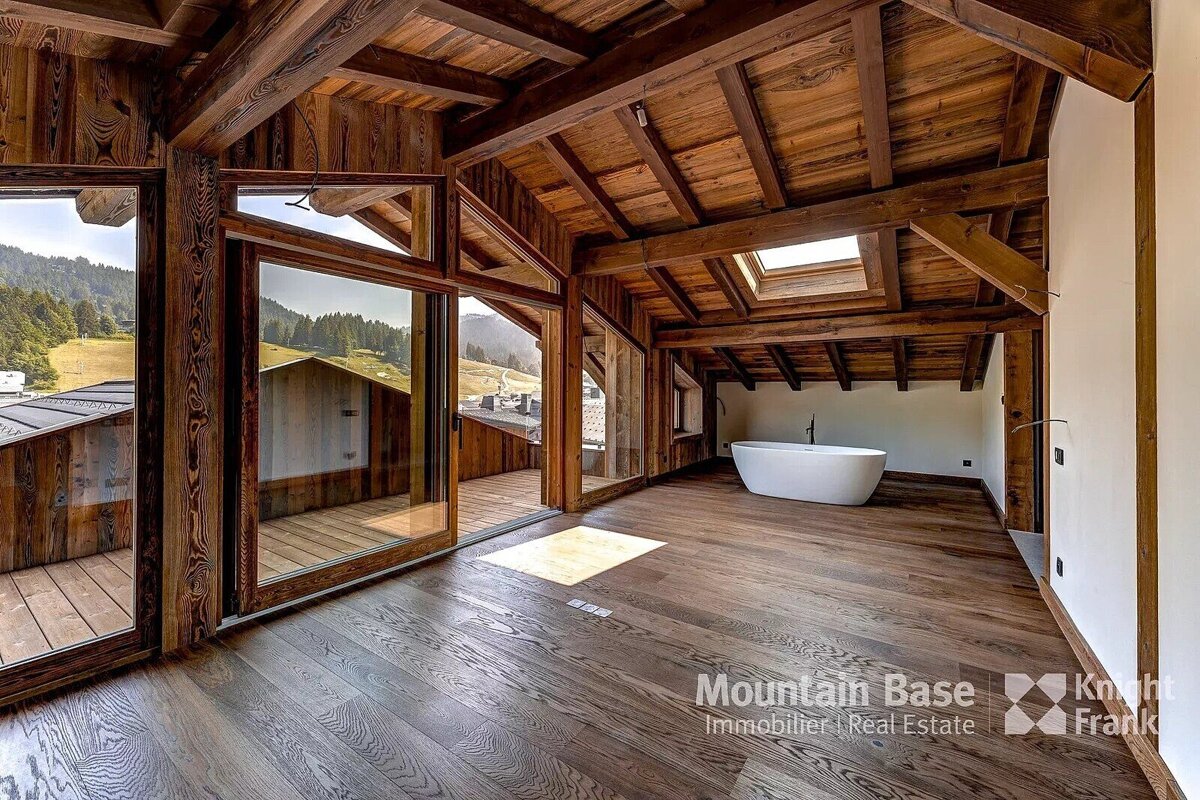 A bathroom with a bathtub and a sign that says mountain base