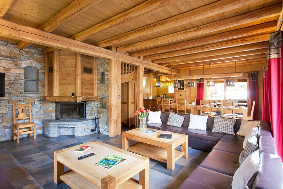 A living room with a couch a coffee table and a fireplace
