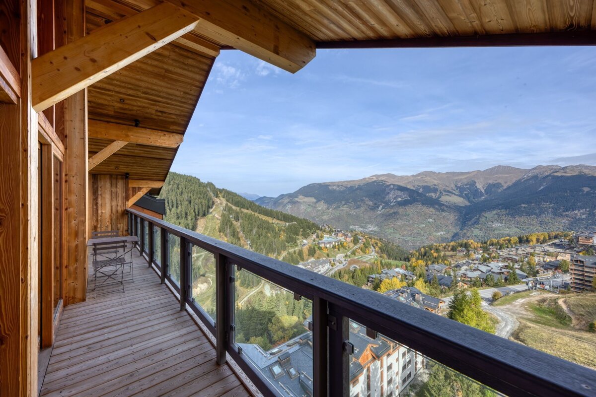 A balcony with a view of a mountain range