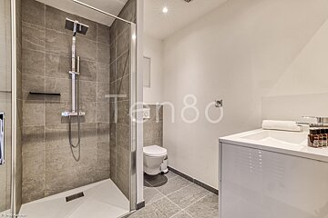 A bathroom with the number 80 on the wall