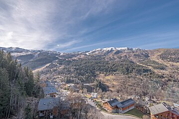 An aerial view of a small town in the mountains