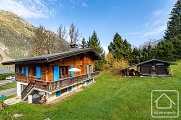 A house with blue shutters is for sale by alpine property