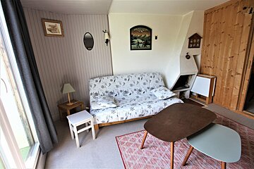 A living room with a couch and a coffee table