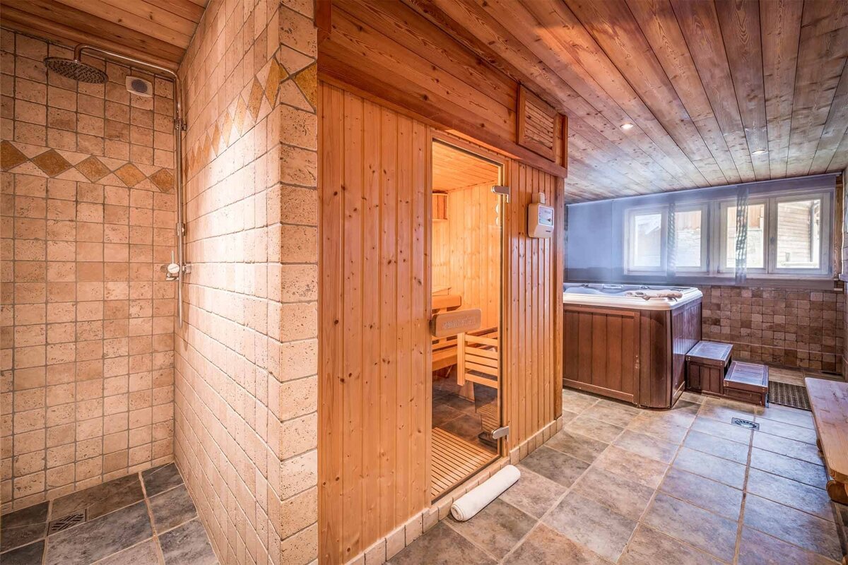 A bathroom with a sauna and a hot tub