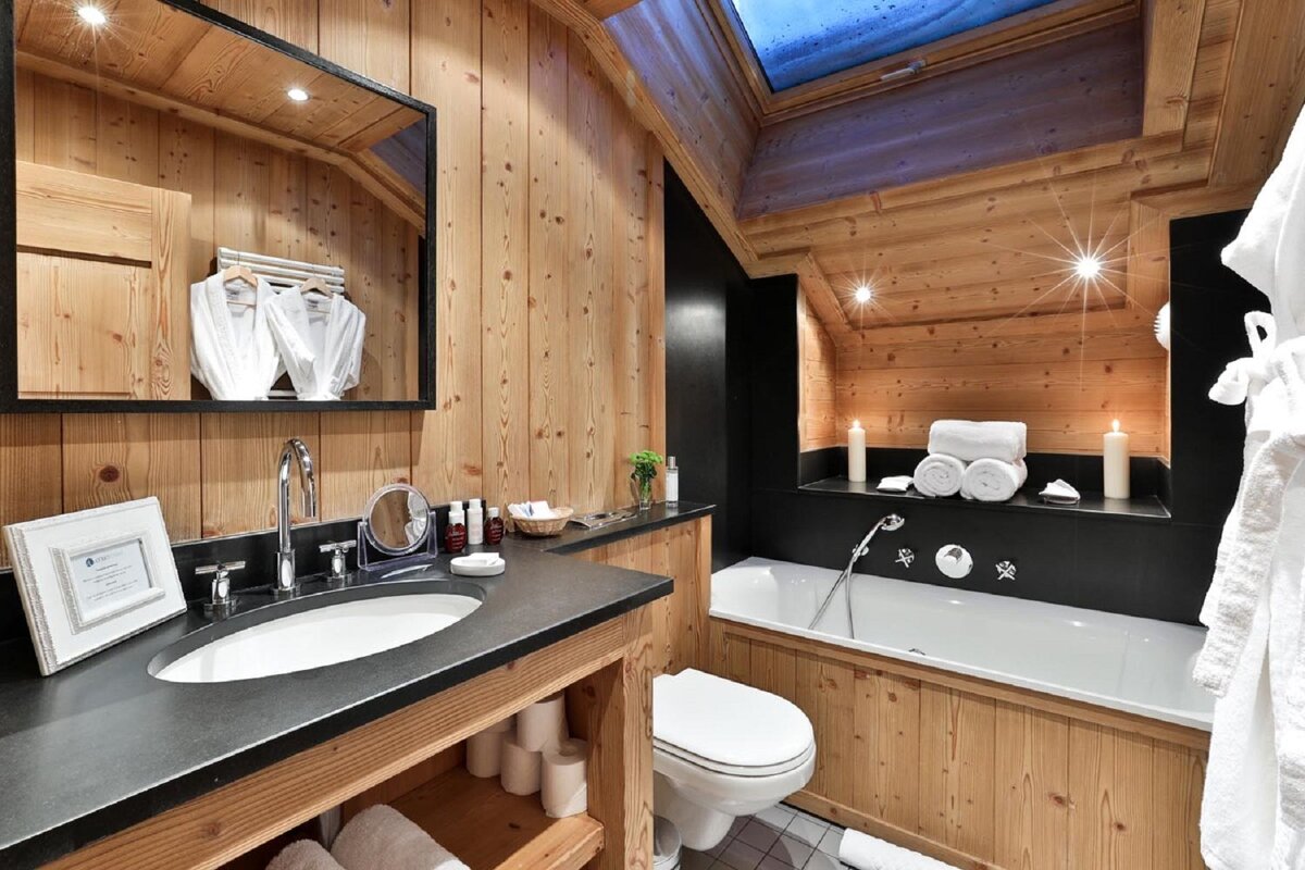 A bathroom with a sink toilet and bathtub
