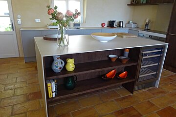 A kitchen with a book titled