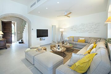 A living room with a couch and a flat screen tv