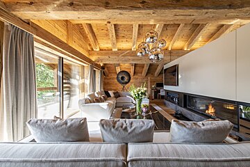 A living room filled with furniture and a fireplace