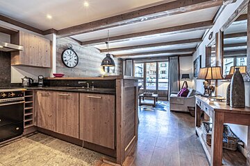 A living room with a couch and a lamp