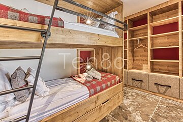 A bunk bed in a room with the number 80 on the wall