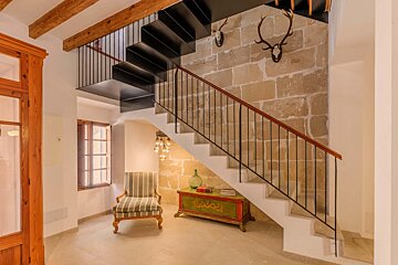 A staircase leading up to the second floor of a house
