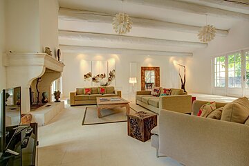 A living room filled with furniture and a fireplace