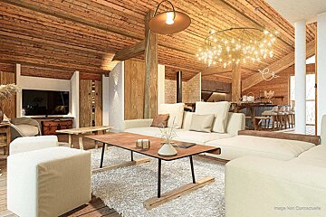 Cozy luxury chalet living room with warm wooden walls, a white sectional sofa, a shaggy rug, and sparkling lights.