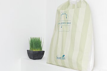 A laundry bag that says sweet inn on it