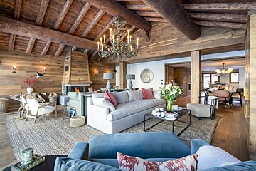 A living room filled with furniture and a chandelier