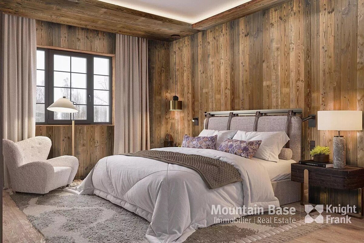 A bedroom with a bed and a chair and a sign that says mountain base
