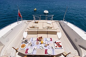 A table set up on the back of a boat in the ocean