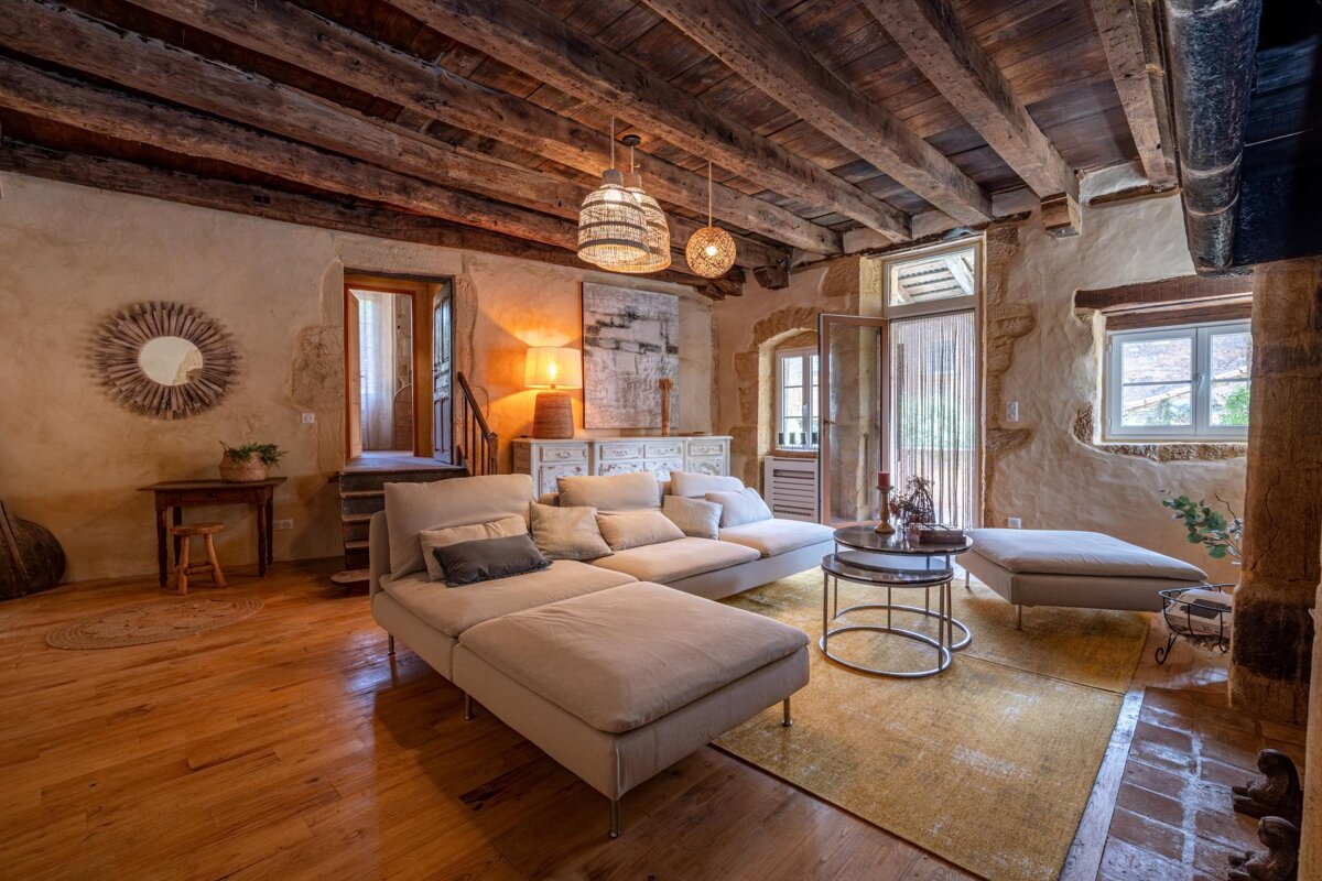 A living room with a couch and two tables