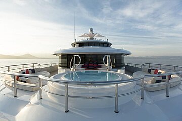 A large yacht with a hot tub on the deck