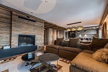 A living room with a fireplace and a couch