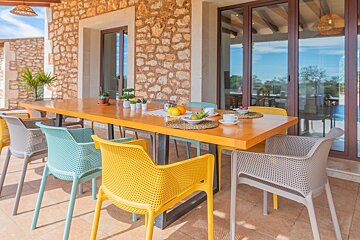 A table with a bowl of fruit on it