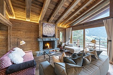 A living room with a fireplace and a couch