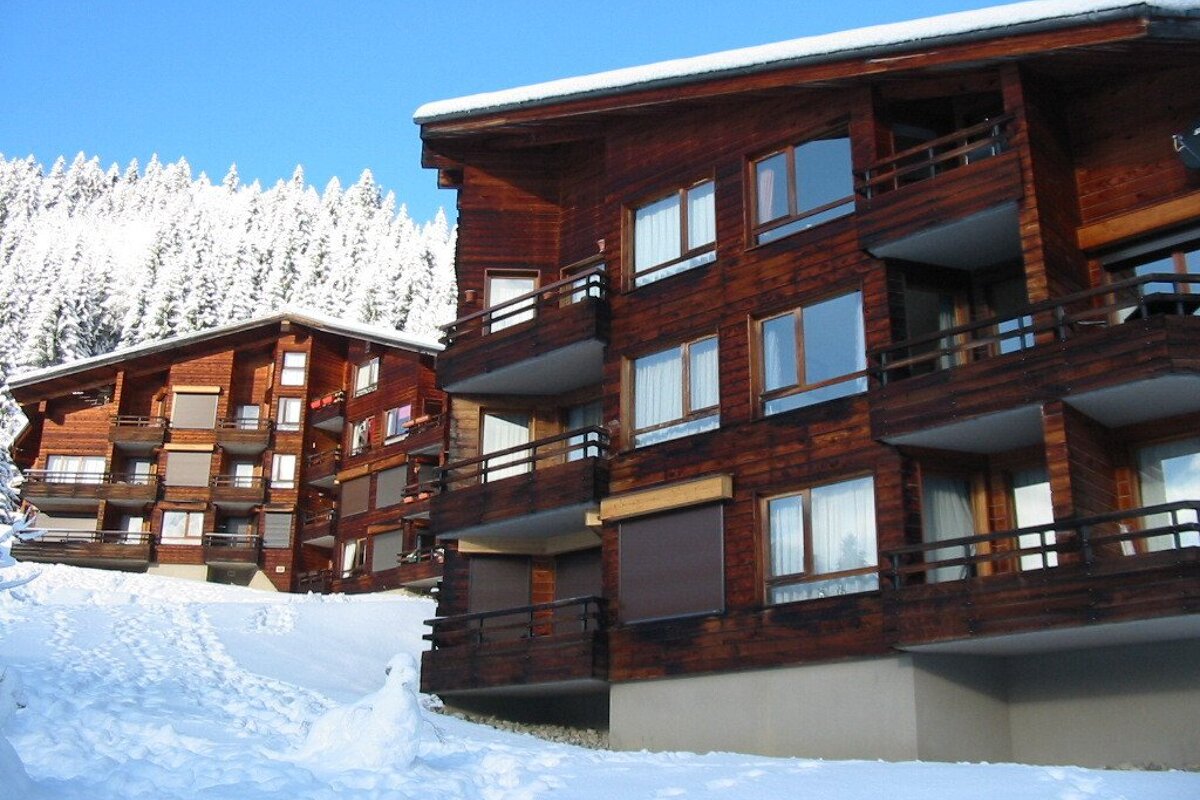 A building with a balcony and a sign that says ' a ' on it