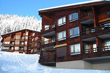 A building with a balcony and a sign that says ' a ' on it