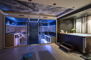 A spa with a hot tub and a sauna