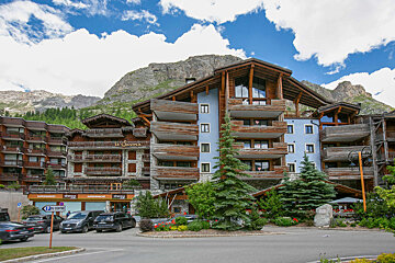 A large building with a sign that says no entry