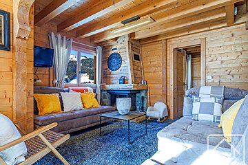 A living room with a fireplace and a couch