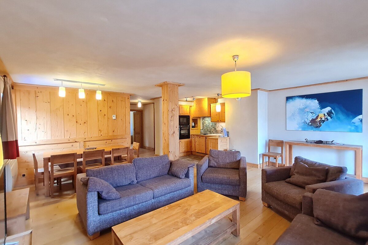 A living room with a picture of a snowboarder on the wall