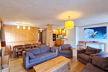 A living room with a picture of a snowboarder on the wall