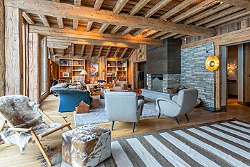 A dining room with a poster of chamonix-hastigny on the wall
