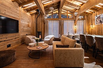 A living room with a couch and a flat screen tv