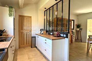 A kitchen with the words made in provence immobilier on the bottom