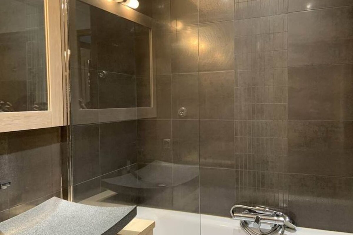 A bathroom with a bathtub and a sink