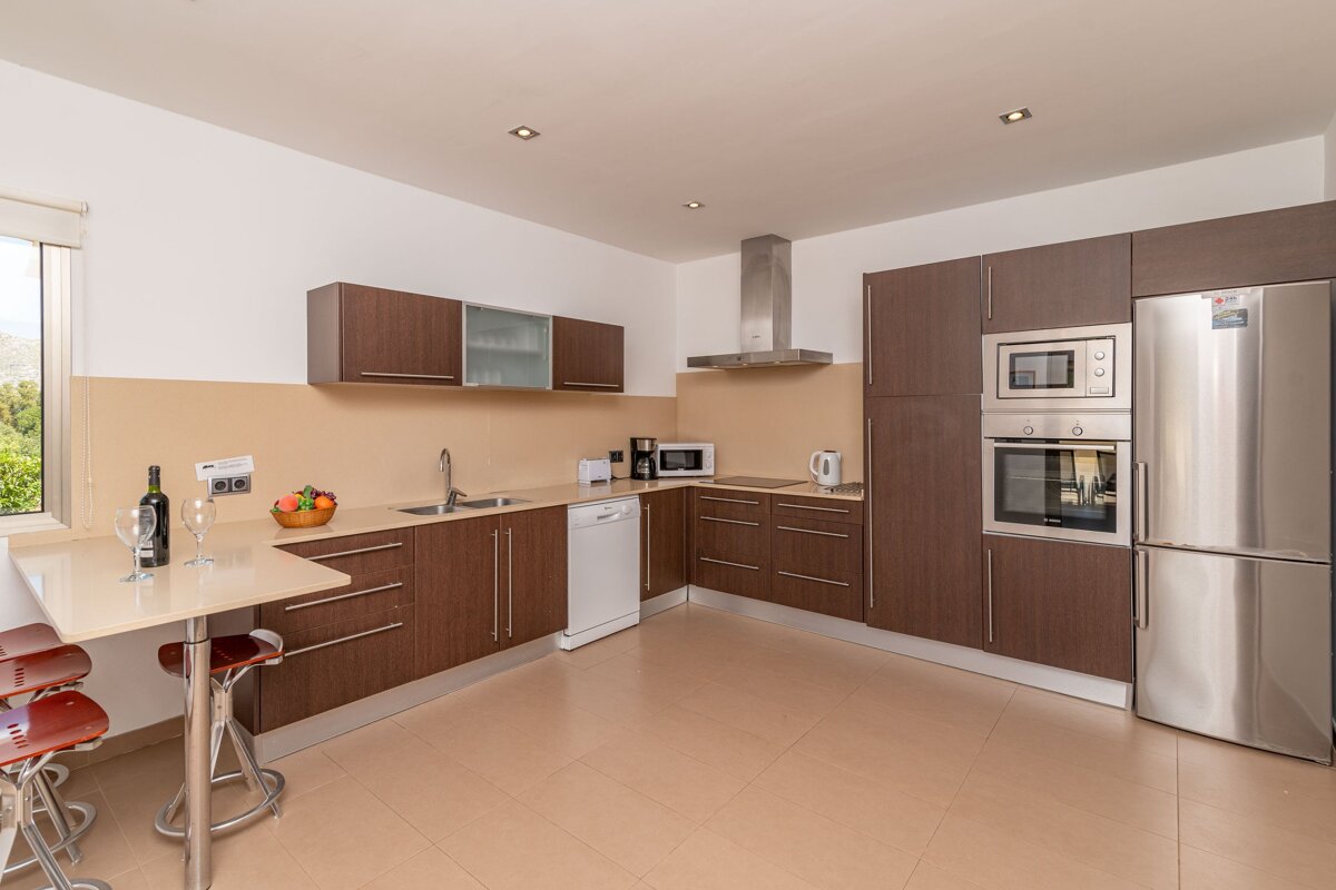 A kitchen with stainless steel appliances including an lg refrigerator