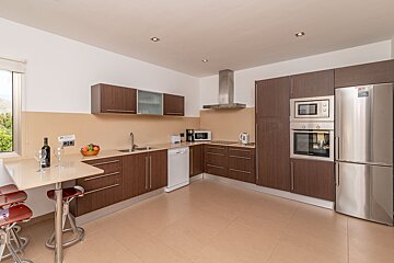 A kitchen with stainless steel appliances including an lg refrigerator
