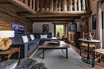A living room with a couch and a table
