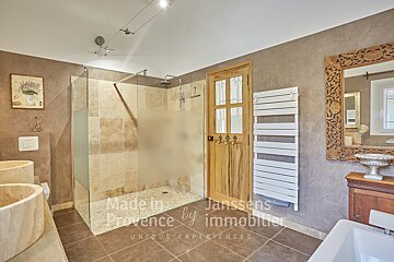 A bathroom with the words made in provence by immobilier on the wall