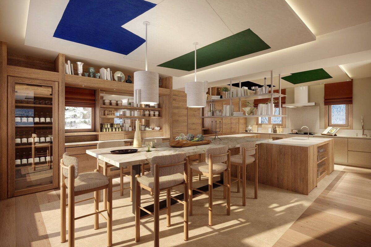 A modern, light wood kitchen and dining area featuring a long marble island, cozy bar stools, colorful ceiling accents, and a built-in wine cooler.