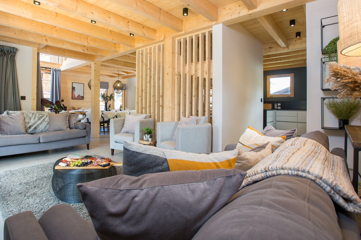 A living room with a couch a chair and a coffee table