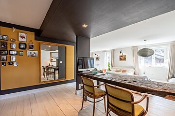 A living room with a large mirror on the wall