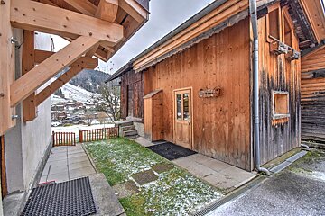 A wooden building with a sign on the side that says ' a ' on it