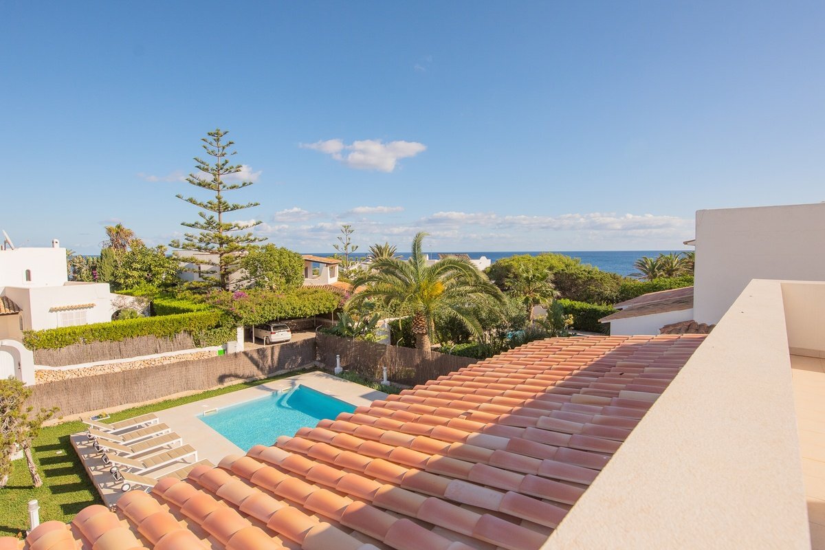 A view of a swimming pool from the top of a building