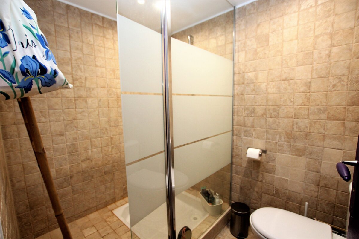 A bathroom with a pillow that says iris on it