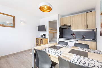 A kitchen with a table that says appetit on it