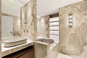 A bathroom with two sinks and a bathtub