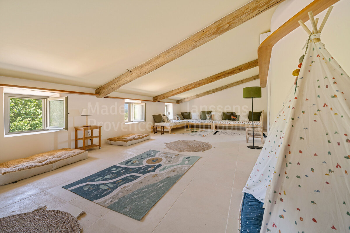A room with a teepee and a rug that says made in provence